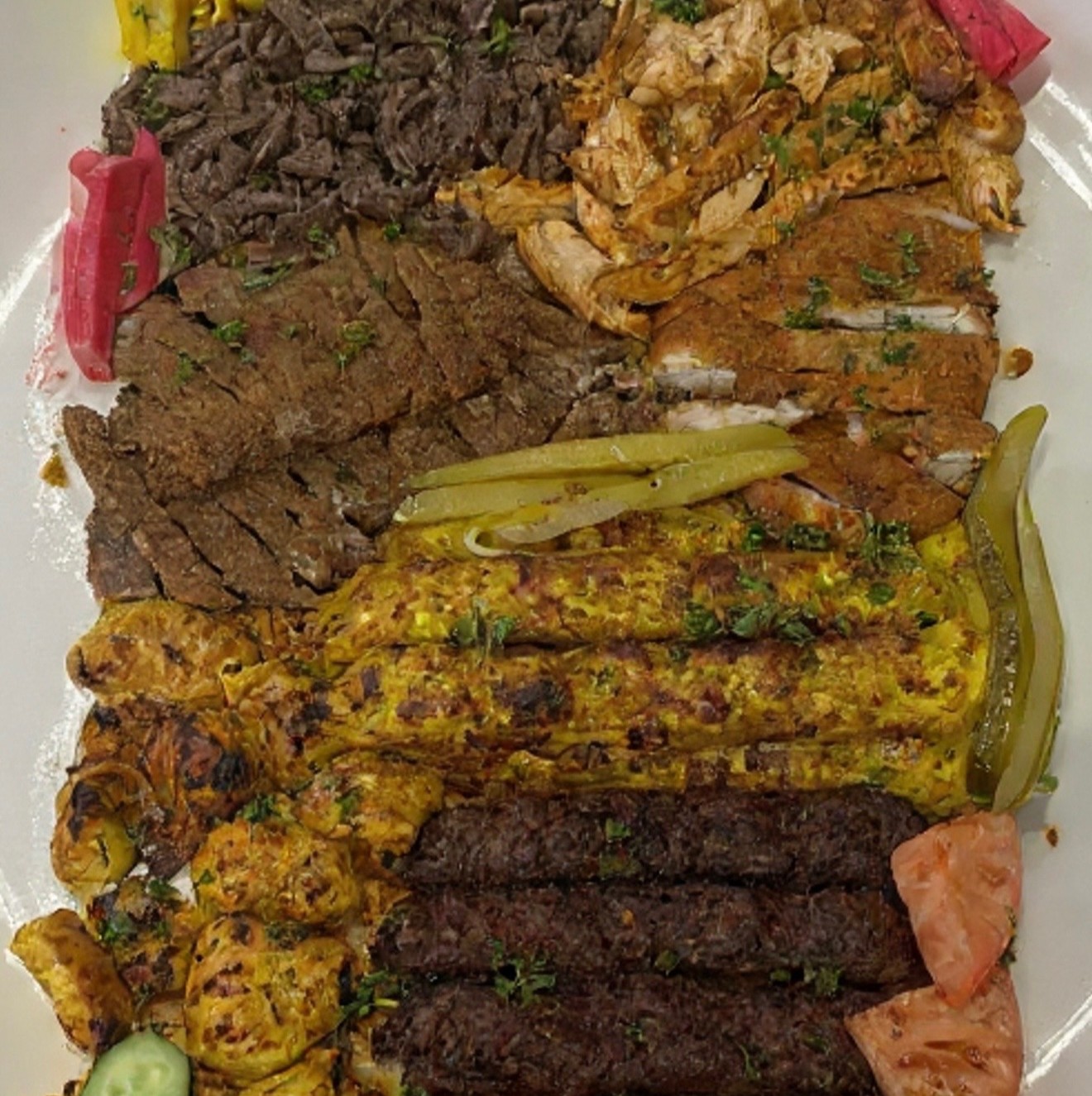 Mixed grill platter of halal shawarma, kafta and tikka