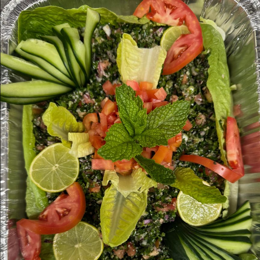 Tabbouli tray with tomato, cucumber and lime